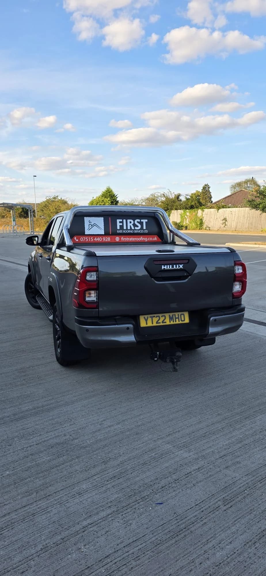 First Rate Roofing pickup on site with a UK number plate
