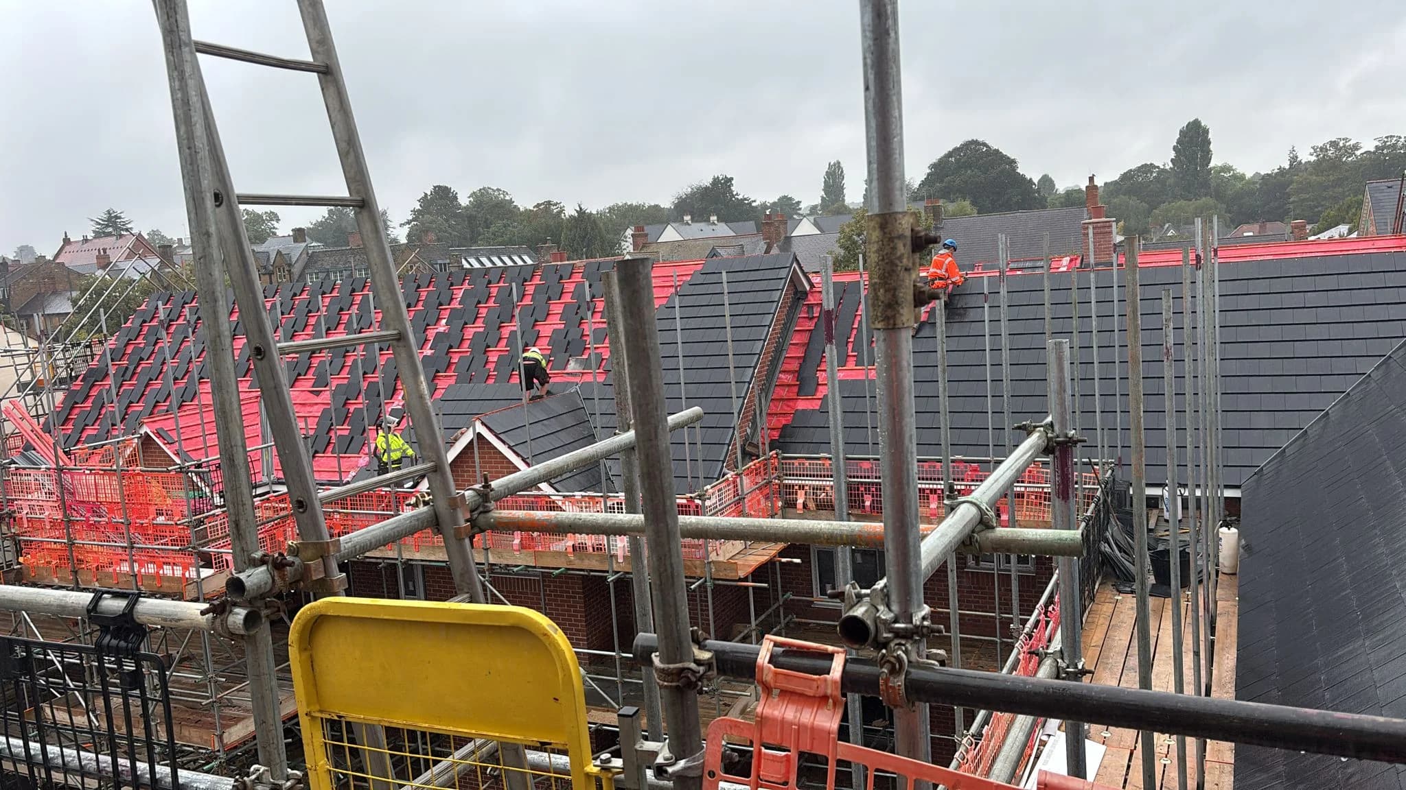 Access scaffolding erected around a building for roof works