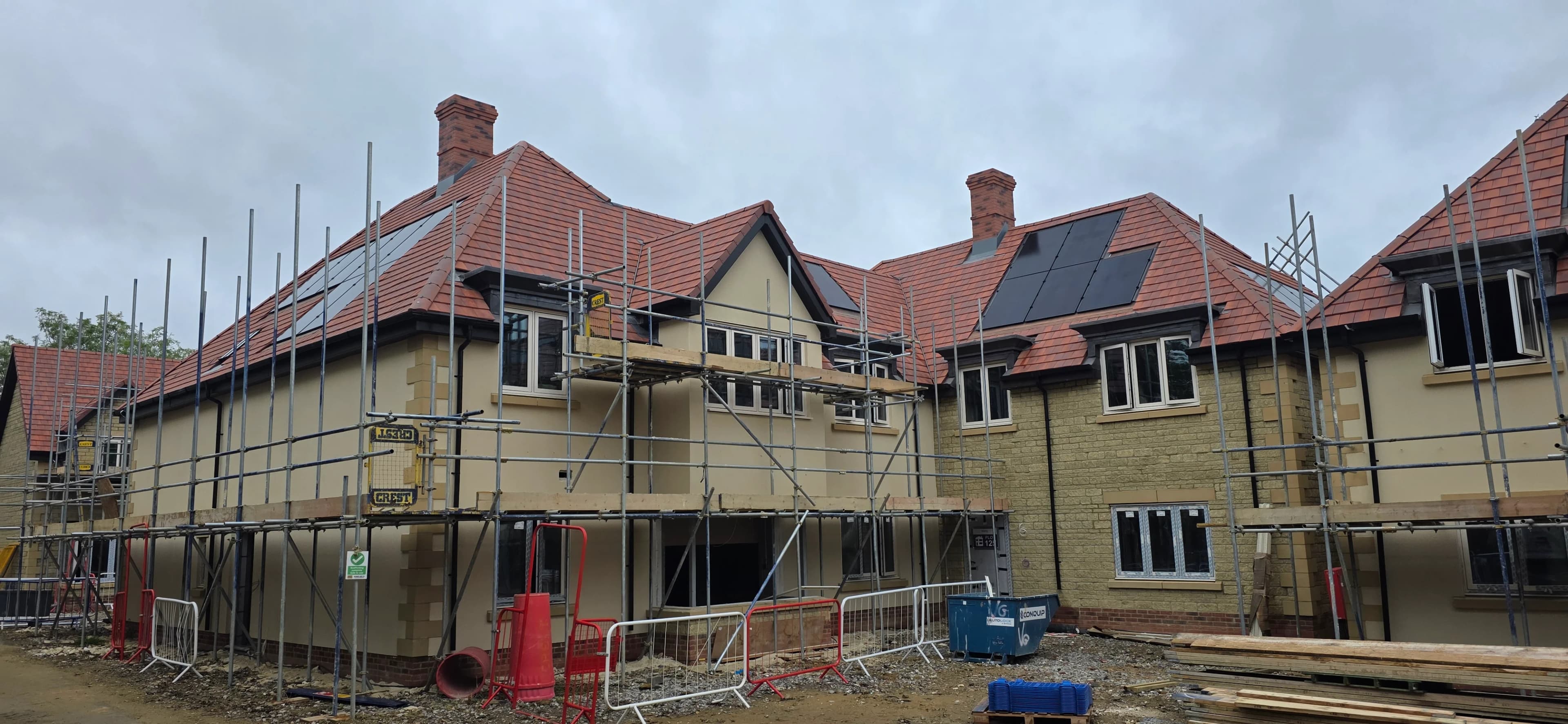Terrace of new homes being roofed on a development site