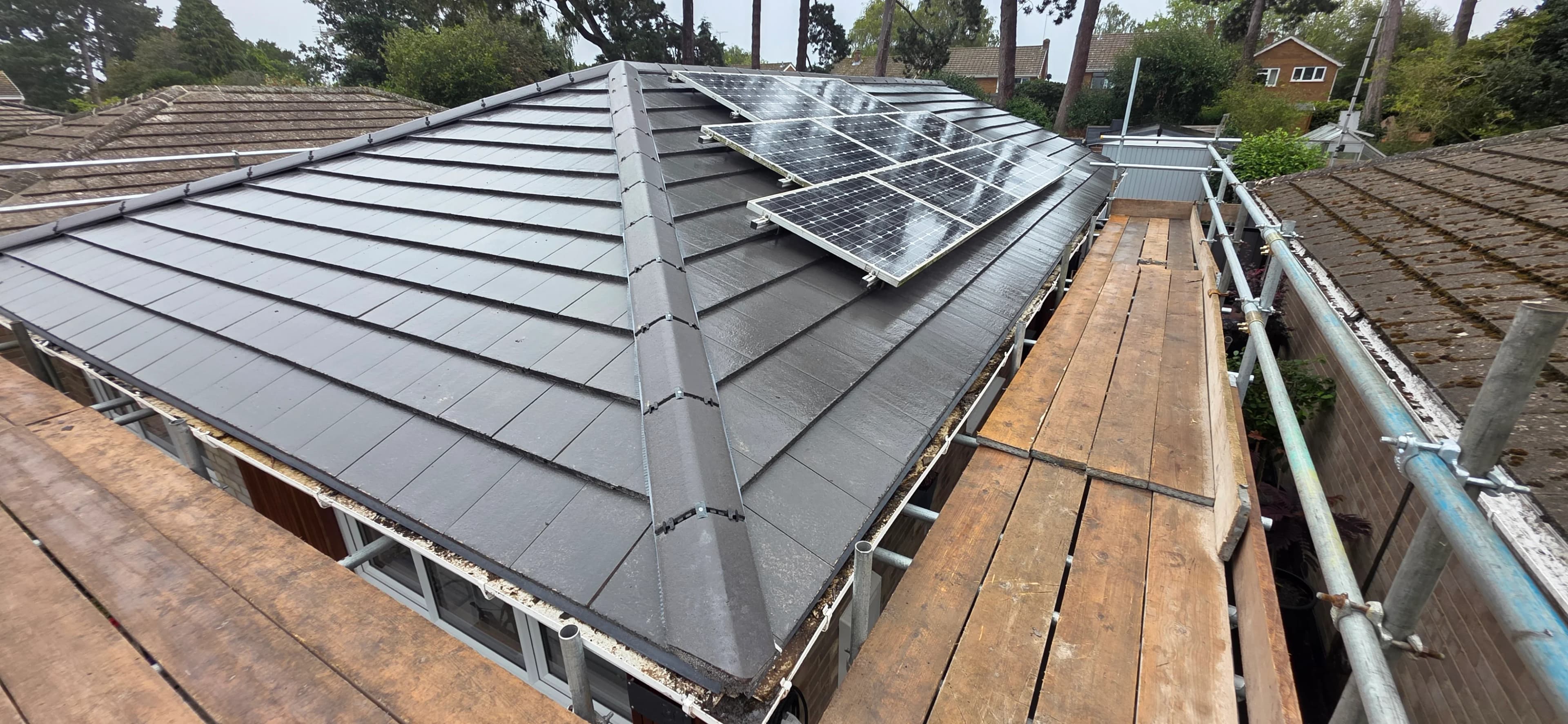Grey slate roof with rooflights after completion
